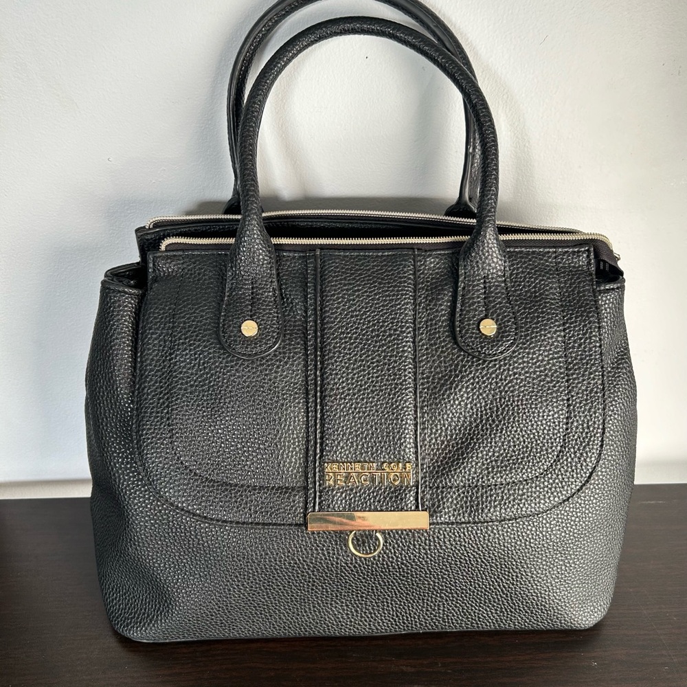 Kenneth Cole Reaction Handbag with gold details.